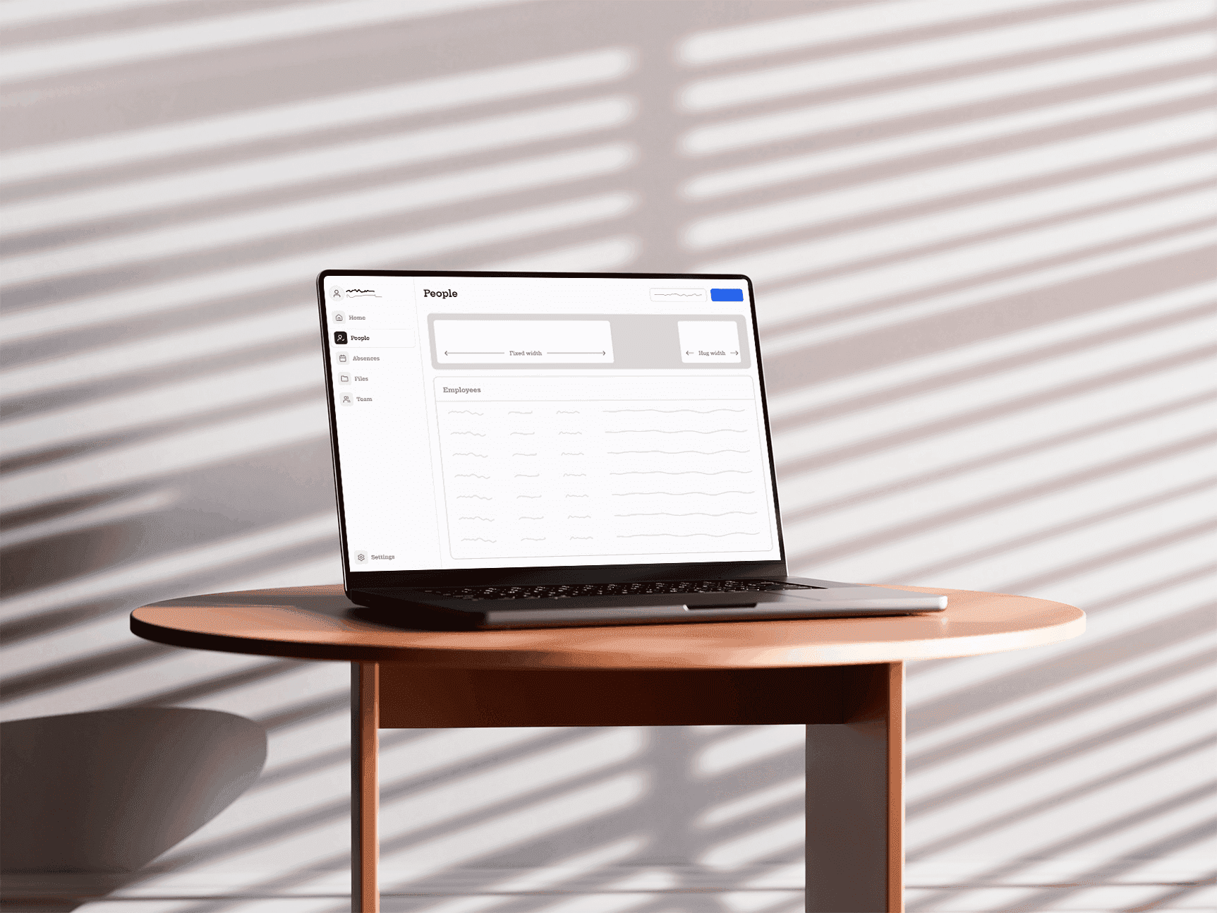 Laptop showing the payroll submission tool on a desk in warm light